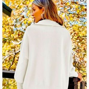 White zip up sweater. New without tags.